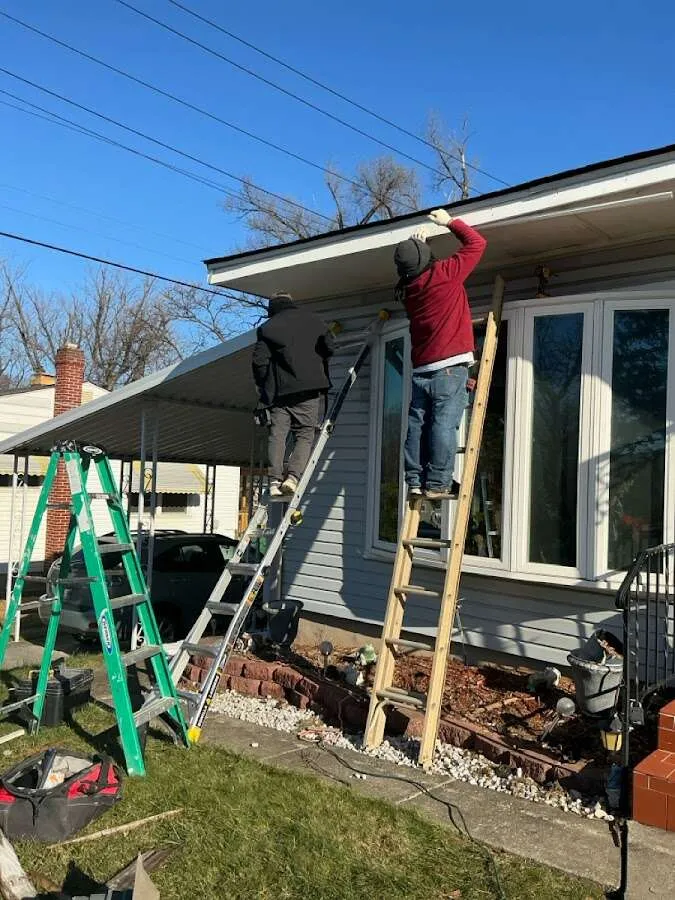 Restoration crew performing exterior repair in Lee